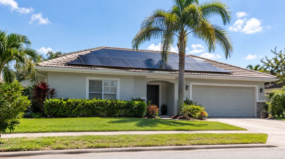 Florida home with solar panels on a tile roof